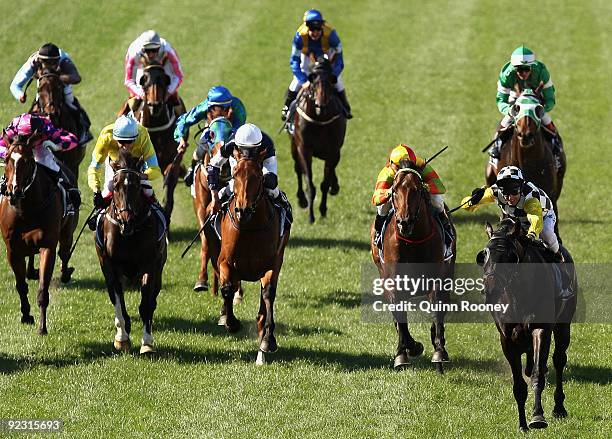 Glen Boss riding So You Think celebrates as he crosses the line to win the Tatts Cox Plate during the 2009 Cox Plate Day meeting at Moonee Valley...