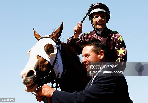 Damien Oliver riding Apache Cat celebrates as he returns to scale after winning the Schweppes Stakes during the 2009 Cox Plate Day meeting at Moonee...