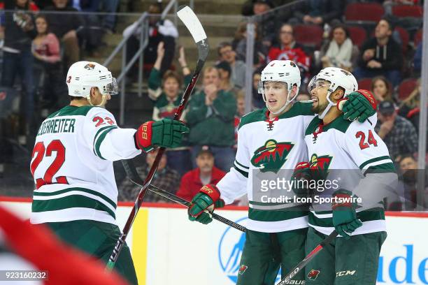 Minnesota Wild defenseman Mike Reilly celebrates after scoring during the second period of the National Hockey League game between the New Jersey...