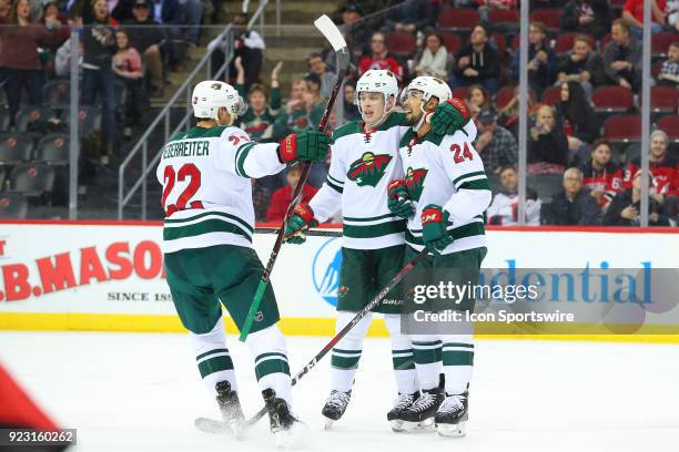 Minnesota Wild defenseman Mike Reilly celebrates after scoring during the second period of the National Hockey League game between the New Jersey...