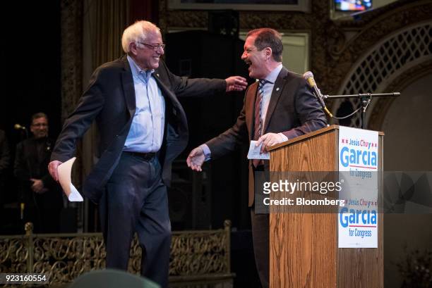 Senator Bernie Sanders, an Independent from Vermont, left, greets Jesus Garcia, Democratic U.S. House candidate from Chicago, during a campaign rally...