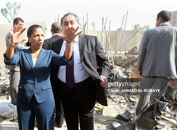 Envoy to the United Nations Susan Rice gestures as she stands with Iraqi Foreign Minister Hoshyar Zebari on October 24 looking at the destroyed...