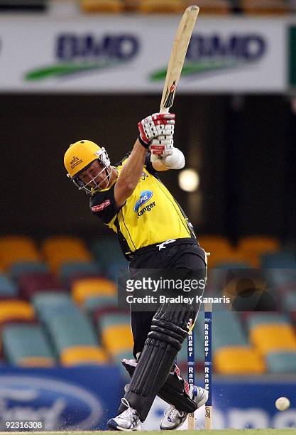 Ashley Noffke of the Warriors is clean bowled by Nathan Rimmington of the Bulls during the Ford Ranger Cup match between the Queensland Bulls and the...