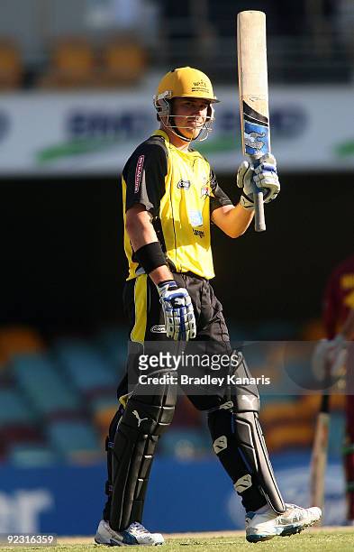 Marcus North of the Warriors celebrates reaching his half century during the Ford Ranger Cup match between the Queensland Bulls and the Western...