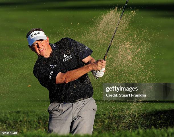 Colin Montgomerie of Scotland plays his bunker on the 17th hole during the continuation of the delayed second round of the Castello Masters Costa...