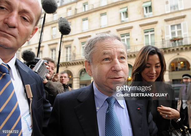 Ex-Ferrari F1 team chief, French Jean Todt , flanked by his companion, actress Michele Yeoh, arrives on October 23, 2009 for the election of a new...