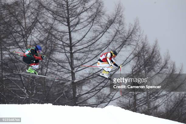 Talina Gantenbein of Switzerland and Lisa Andersson of Sweden compete during the Freestyle Skiing Ladies' Ski Cross Quarter Finals on day fourteen of...