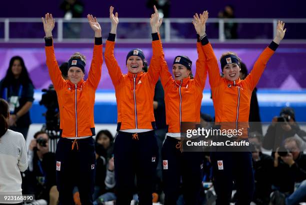 Silver medalists Marrit Leenstra, Lotte Van Beek, Ireen Wust and Antoinette De Jong of the Netherlands celebrate during ceremony following the Speed...