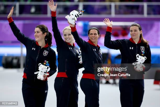 Bronze medalists Heather Bergsma, Brittany Bowe, Mia Manganello and Carlijn Schoutens of the United States celebrate during ceremony following the...