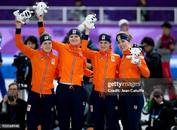 Silver medalists Marrit Leenstra, Lotte Van Beek, Ireen Wust and Antoinette De Jong of the Netherlands celebrate during ceremony following the Speed...