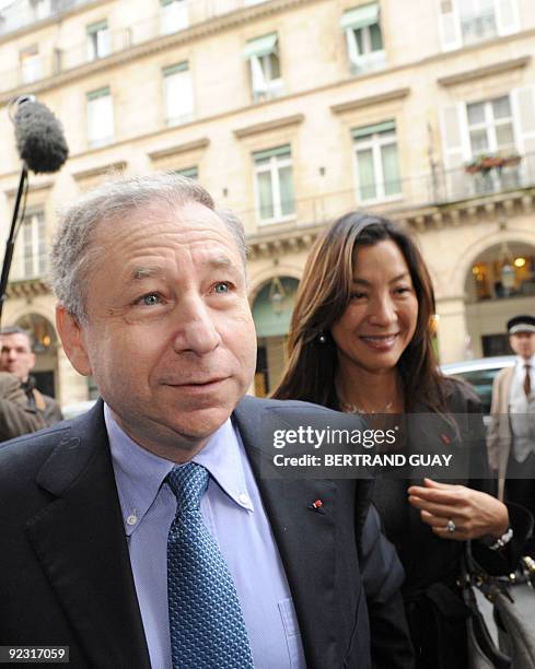 Ex-Ferrari F1 team chief, French Jean Todt, flanked by his companion, actress Michele Yeoh, arrives on October 23, 2009 for the election of a new...