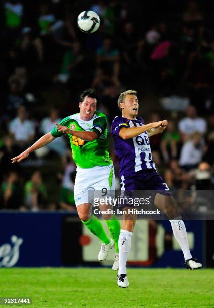 Robbie Fowler of the Fury and Jamie Coyne of the Gory compete for the ball during the round 12 A-League match between the North Queensland Fury and...