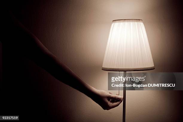 switching to darkness - lampada elettrica foto e immagini stock
