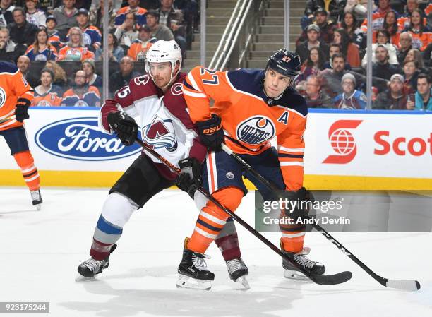 Milan Lucic of the Edmonton Oilers battles for position against Duncan Siemens of the Colorado Avalanche on February 22, 2018 at Rogers Place in...