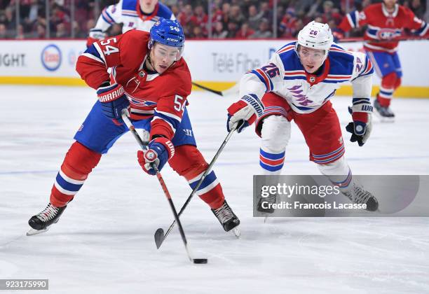 Charles Hudon of the Montreal Canadiens tries to keep the puck from Jimmy Vesey of the New York Rangers in the NHL game at the Bell Centre on...