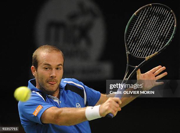 Belgian Olivier Rochus returns the ball on October 24, 2009 to Brazilian Thomaz Bellucci during the semi-final of the Stockholm Open in the Swedish...