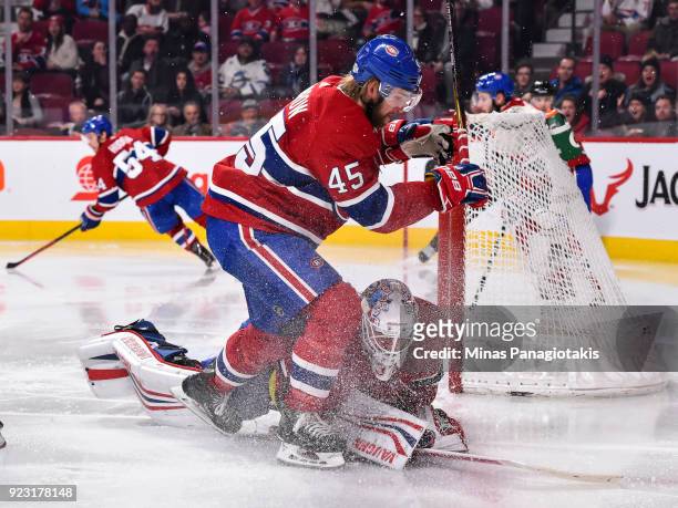 Joe Morrow of the Montreal Canadiens skates into goaltender Antti Niemi against the New York Rangers during the NHL game at the Bell Centre on...