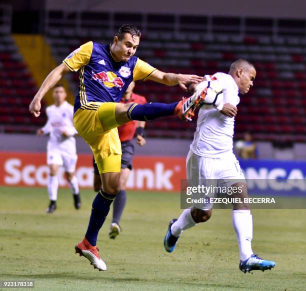 Honduran Olimpia Player Rony Martinez vies for the ball with United States New York Red Bulls Aaron Long for the Concacaf Champions League in...