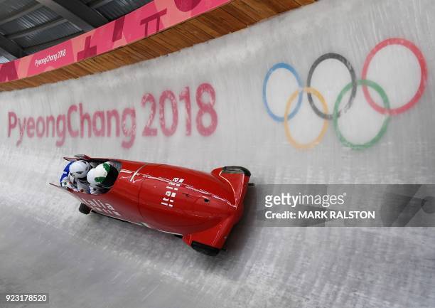 Pilot Simone Bertazzo of Italy corners at turn 14 in their 4-man bobsleigh training session during the Pyeongchang 2018 Winter Olympic Games, at the...
