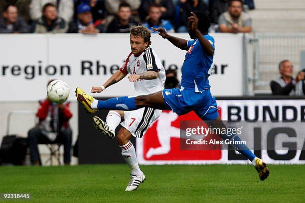 Daniel Gygax of Nuernberg is challenged by Chinedu Obasi of Hoffenheim during the Bundesliga match between 1899 Hoffenheim and 1. FC Nuernberg at the...