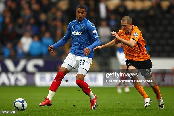 Kevin-Prince Boateng of Portsmouth competes for the ball with Dean Marney of Hull City during the Barclays Premier League match between Hull City and...