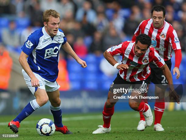 Seb Larsson of Birmingham City tangles with Kieran Richardson of Sunderland during the Barclays Premier League match between Birmingham City and...