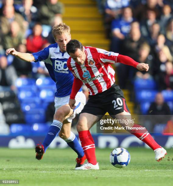 Seb Larsson of Birmingham City tangles with Andy Reid of Sunderland during the Barclays Premier League match between Birmingham City and Sunderland...