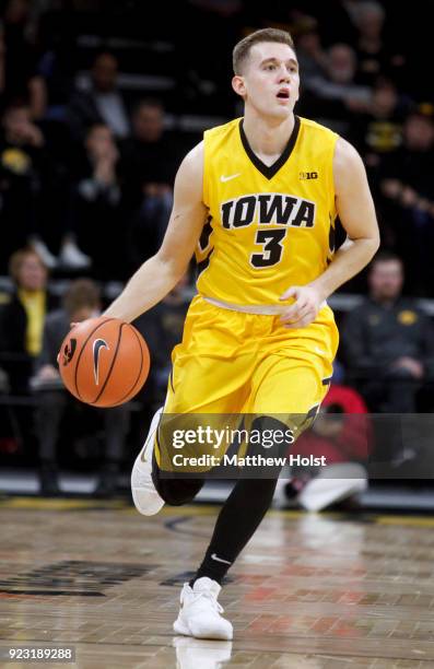 Guard Jordan Bohannon of the Iowa Hawkeyes brings the ball down the court during the first half against the Indiana Hoosiers on February 17, 2018 at...