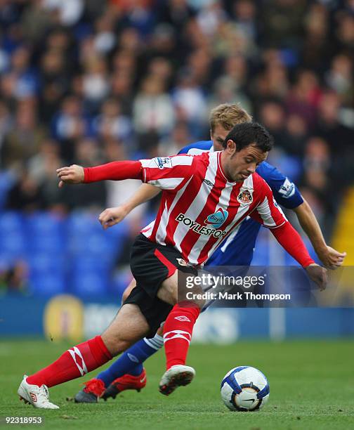 Seb Larsson of Birmingham City tangles with Andy Reid of Sunderland during the Barclays Premier League match between Birmingham City and Sunderland...