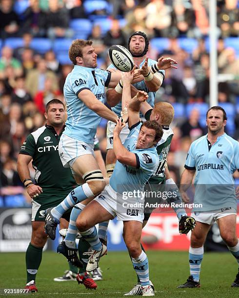 Tom Croft, Richard Blaze and James Grindal of Leicester Tigers challenge for a high ball with Tom Homer of London Irish during the Guinness...