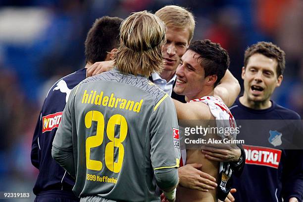 Franco Zuculini of Hoffenheim celebrates with manager Jan Schindelmeiser, Timo Hildebrand and Vedad Ibisevic during the Bundesliga match between 1899...