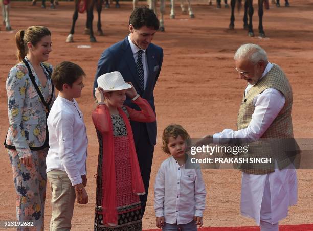 India's Prime Minister Narendra Modi touches the cheek of Hadrien Trudeau , the youngest son of Canada's Prime Minister Justin Trudeau and his wife...