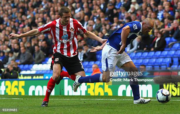 Stephen Carr of Birmingham City tangles with George McCartney of Sunderland during the Barclays Premier League match between Birmingham City and...