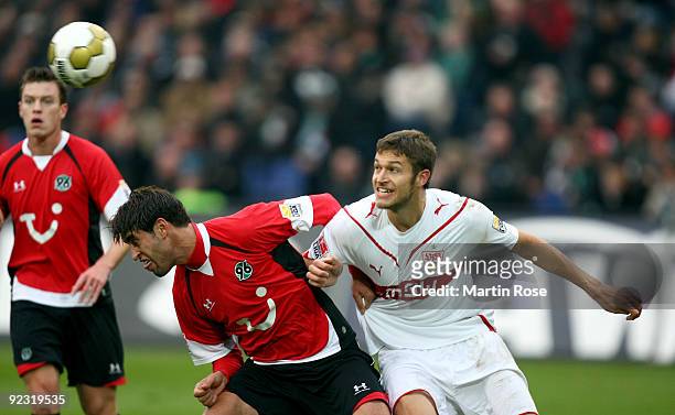Karim Haggui of Hannover 96 and Matthieu Delpierre of Stuttgart compete for the ball during the Bundesliga match between Hannover 96 and VfB...