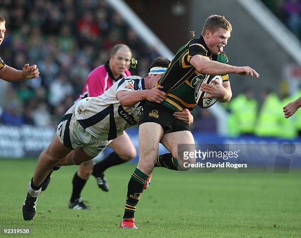 Chris Ashton of Northampton moves away from Mark Jones during the Guinness Premiership match between Northampton Saints and Sale Sharks at Franklin's...