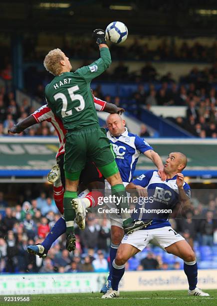 Goalkeeper Joe Hart of Birmingham City tangles with Kenwyne Jones of Sunderland and his own defenders Stephen Carr and Lee Carsley during the...