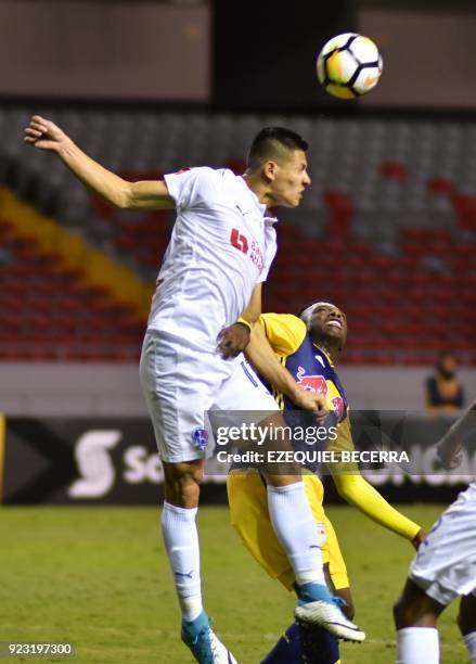 Honduran Olimpia Player Rony Martinez vies for the ball with United States New York Red Bulls Bradley Wrigth-Phillips for the Concacaf Champions...