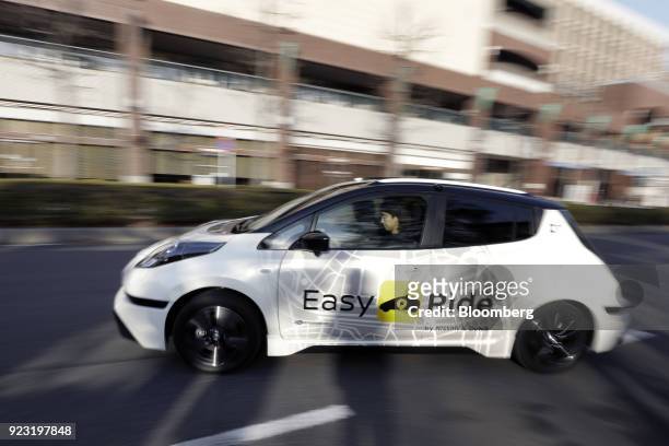 Nissan Motor Co. Leaf electric vehicle used for the "Easy Ride" robot taxi service, jointly developed by Nissan and DeNA Co., operates during a test...