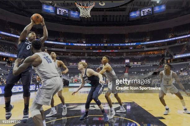 Xavier Musketeers forward Tyrique Jones goes to the basket against Georgetown Hoyas center Jessie Govan on February 21 at the Capital One Arena in...