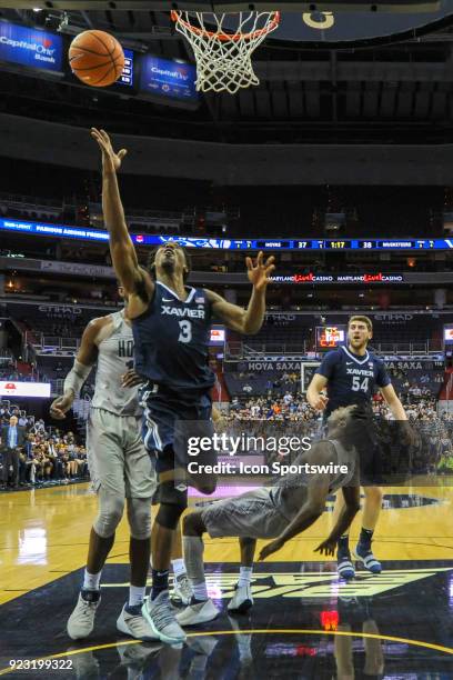 Xavier Musketeers guard Quentin Goodin fouls Georgetown Hoyas guard Jonathan Mulmore on February 21 at the Capital One Arena in Washington, DC. The...