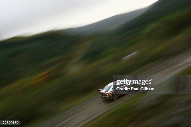 Armindo Araujo of Poland and Ralliart Rally drives a Mitsubishi Evolution IX during stage ten of the Wales Rally GB at Rhondda on October 24, 2009 in...