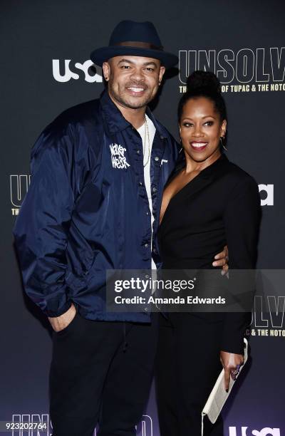 Director Anthony Hemingway and actress Regina King arrive at the premiere of USA Network's "Unsolved: The Murders of Tupac and The Notorious B.I.G."...