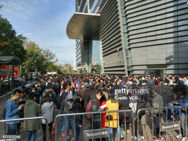 Employees of Chinese Internet giant Tencent queue up to get red envelops from Tencent Chairman and CEO Pony Ma Huateng at the headquarters of Tencent...