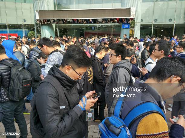 Employees of Chinese Internet giant Tencent queue up to get red envelops from Tencent Chairman and CEO Pony Ma Huateng at the headquarters of Tencent...