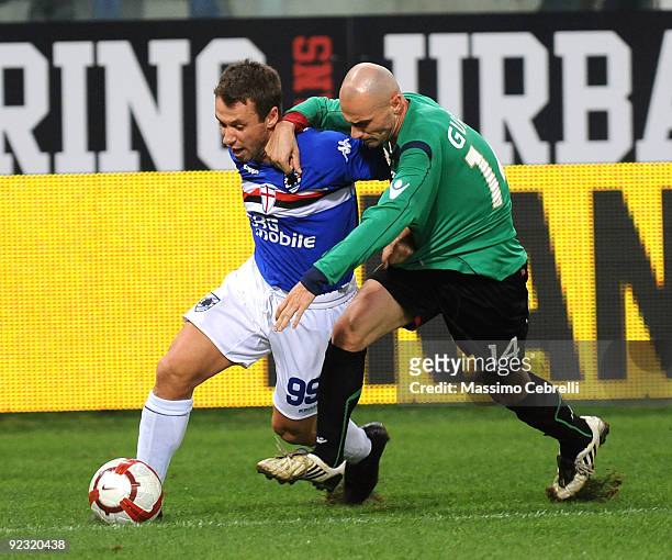 Antonio Cassano of UC Sampdoria battles for the ball against Roberto Guana of Bologna FC during the Serie A match between UC Sampdoria and Bologna FC...