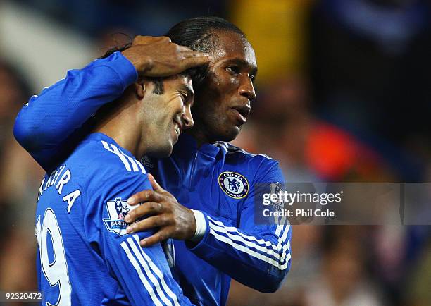 Didier Drogba of Chelsea celebrates with Paulo Ferreira as he scores their fifth goal during the Barclays Premier League match between Chelsea and...