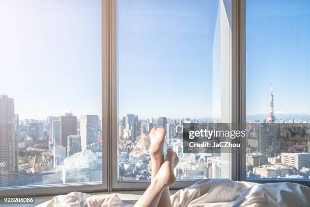 relaxing in the hotel room - tokyo cityscape stock pictures, royalty-free photos & images