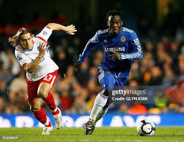 Chelsea's Ghanaian midfielder Michael Essien vies with Blackburn's Spanish defender Michel Salgado during their English Premier League football match...