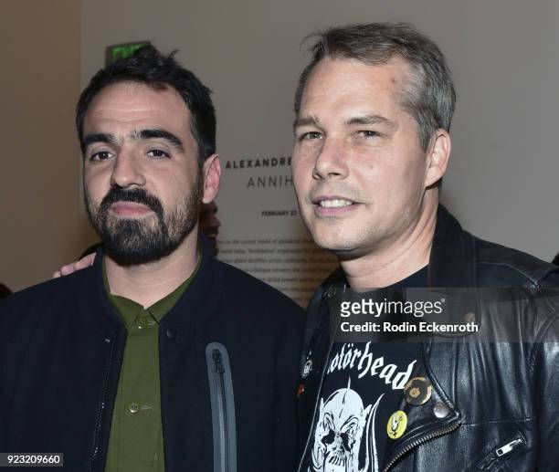 Artist Alexandre Farto aka Vhils and Shepard Fairey pose for portrait at the opening reception for Vhil's "Annihilation" exhibit at Over The...