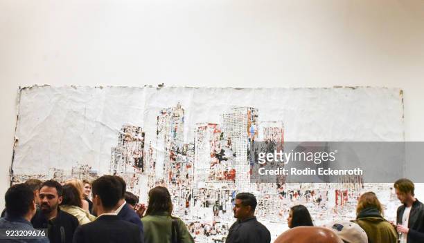 Attendees enjoy art at the opening reception for Vhil's "Annihilation" exhibit at Over The Influence on February 22, 2018 in Los Angeles, California.